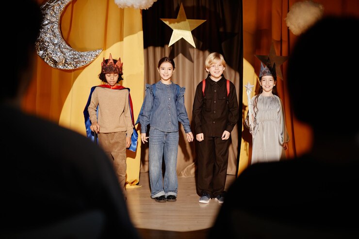 Children performing on stage during a school showcase