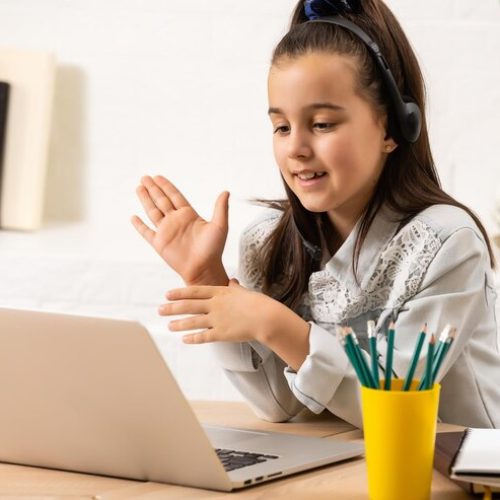 happy-girl-headphones-with-laptop-sitting-table-home_493343-13187 happy-girl-headphones-with-laptop-sitting-table-home_493343-13187